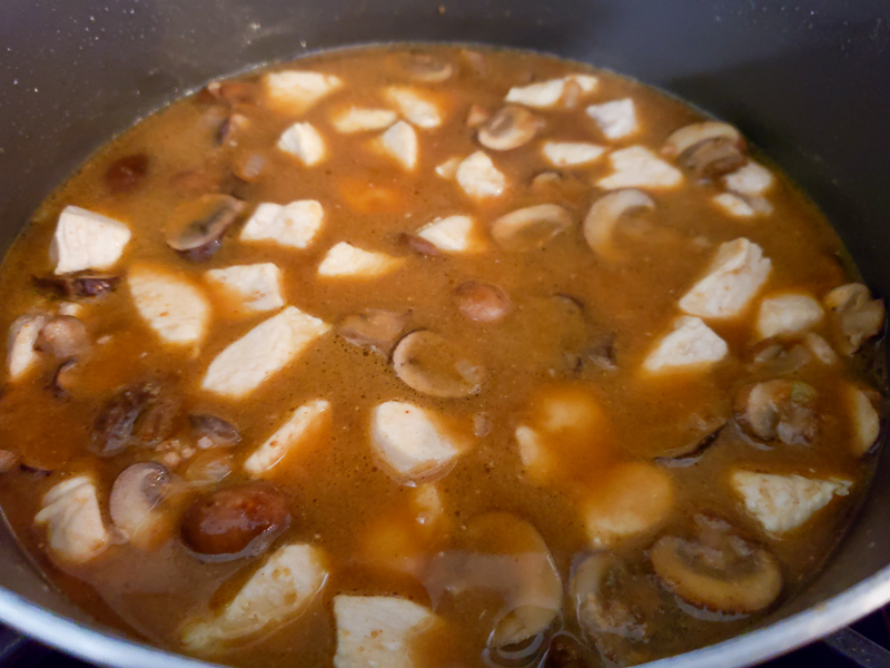 chicken broth, Worcestershire sauce and cooked chicken added to the pan.