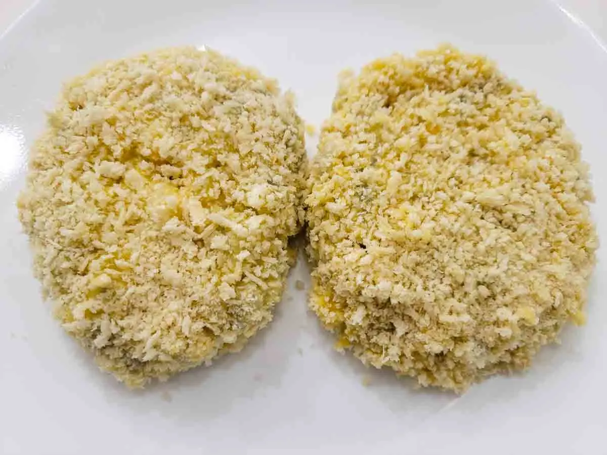 two shrimp patties coated with panko bread crumbs.