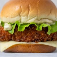 Fried Shrimp Burger on parchment paper.