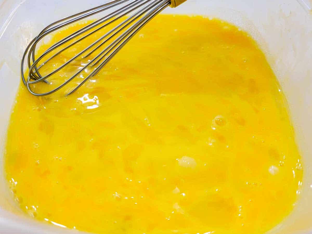 egg whisked in a bowl.