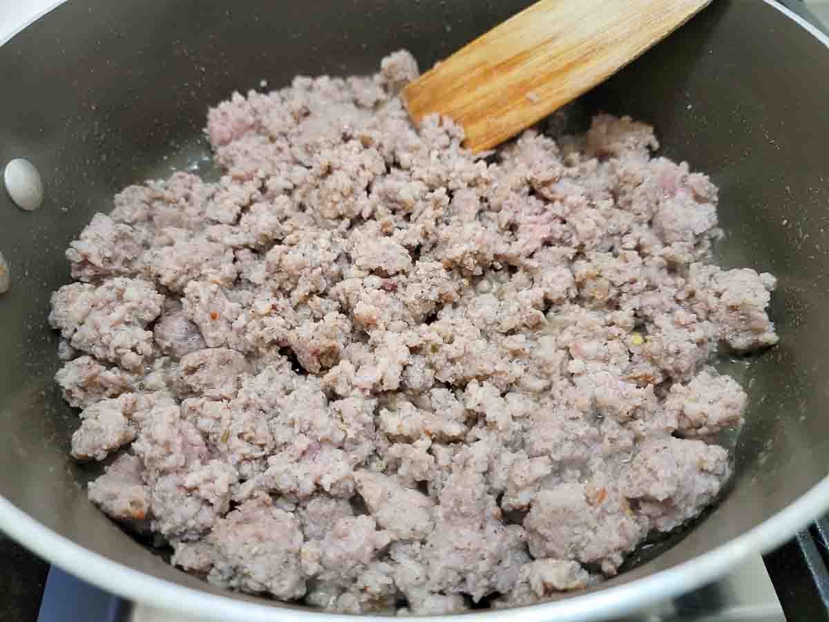 ground pork sausage cooking in a skillet.