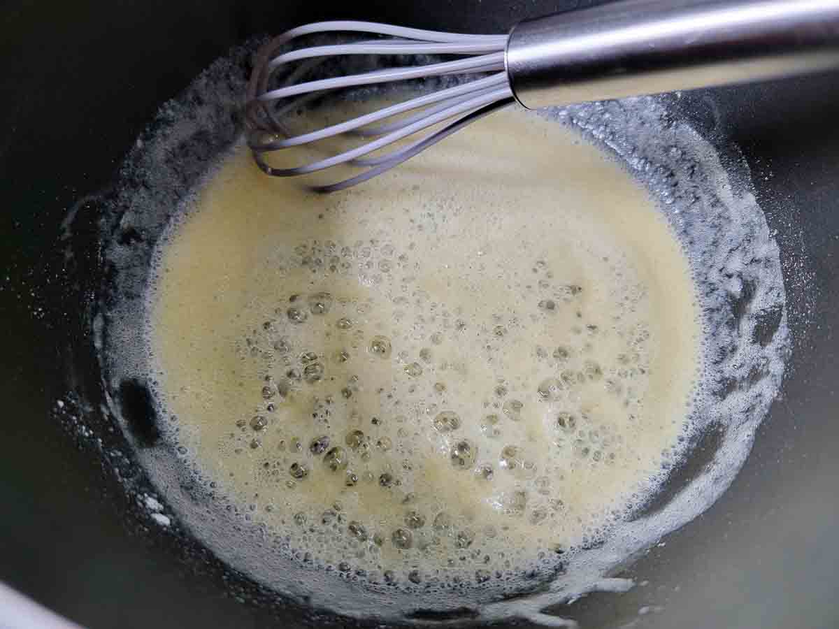flour and butter whisked in a pan.