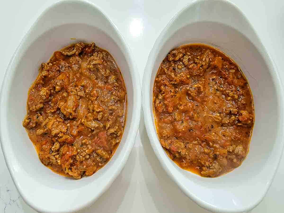 homemade spaghetti meat sauce in two casserole dishes.