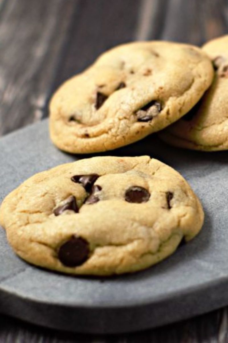 Soft Batch Chocolate Chip Cookies on a cutting board.
