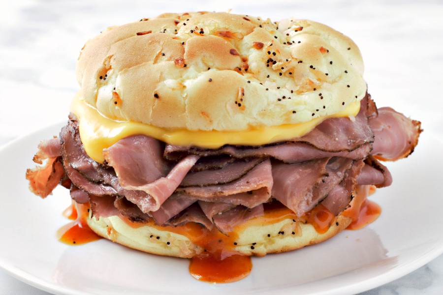 Arby&rsquo;s Roast Beef and Cheddar sandwich on a plate.