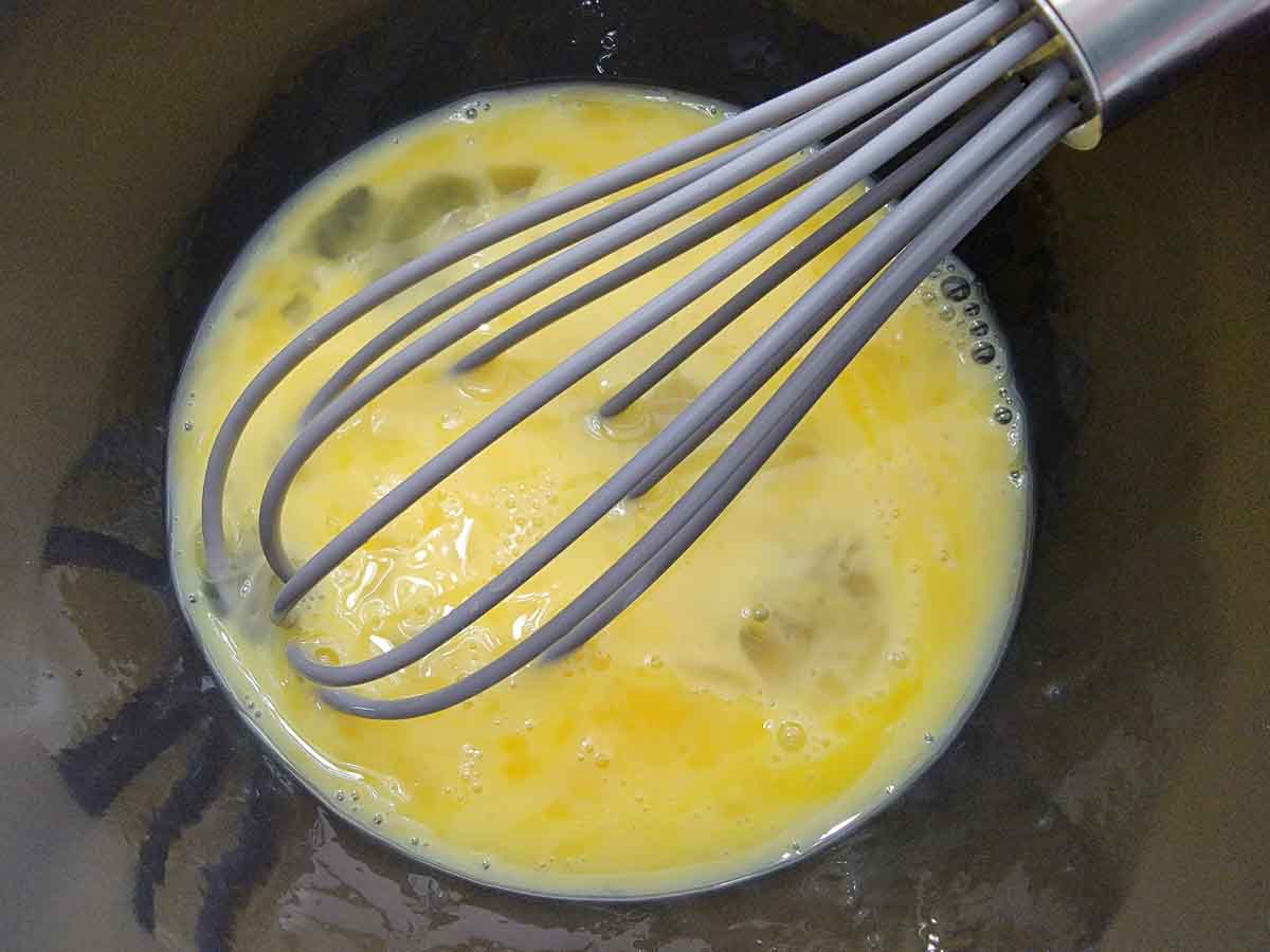 eggs whisked in a bowl.