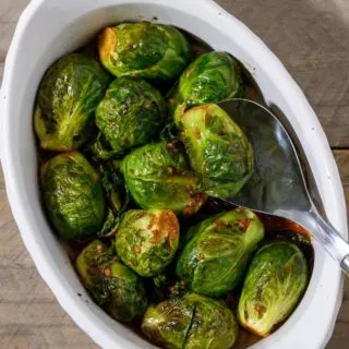 Marinated Brussels Sprouts in a casserole dish.