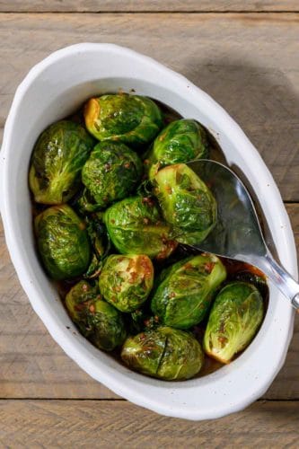 Marinated Brussels Sprouts in a casserole dish.