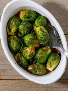 Marinated Brussels Sprouts in a casserole dish.