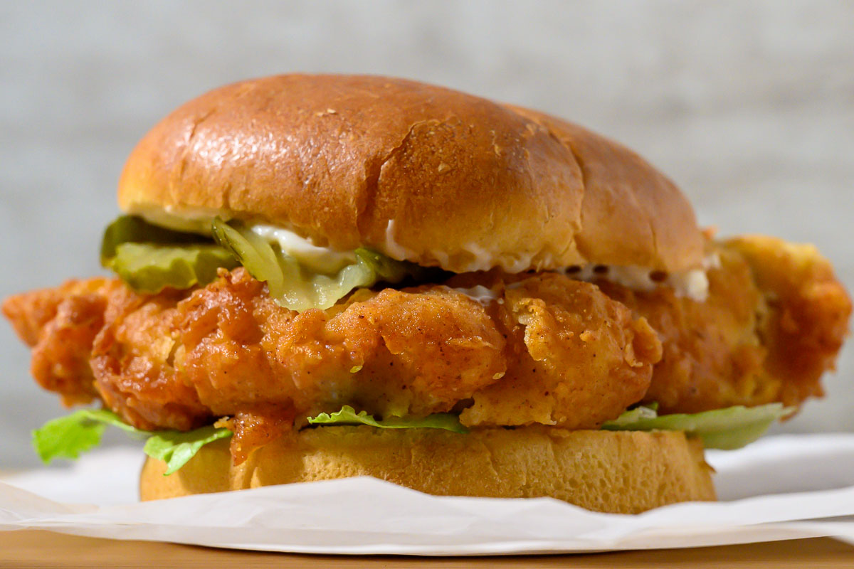 Crispy Chicken Burger topped with lettuce, pickles, and mayo.