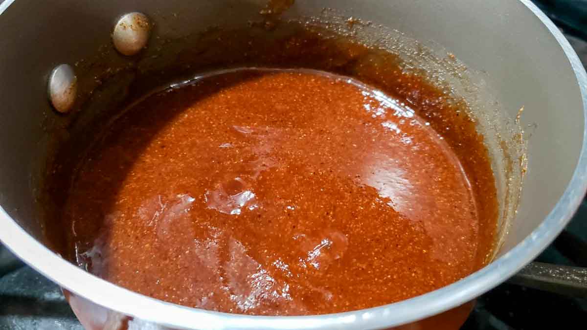 barbecue sauce cooking in a pan.