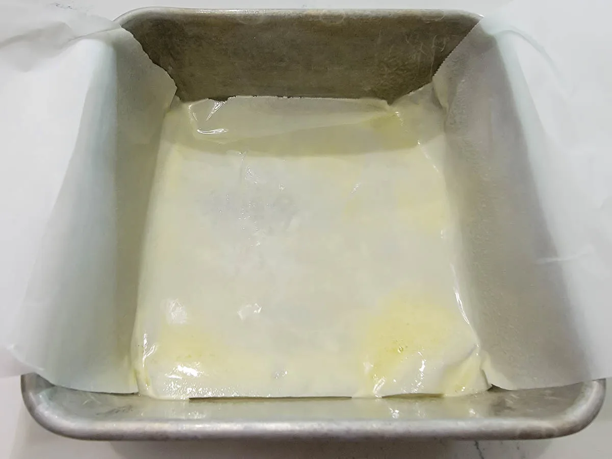 a 6 inch cake pan filled with parchment paper sprayed with non-stick spray.