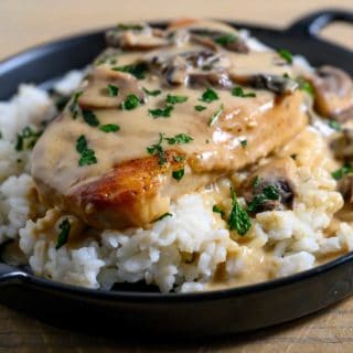 Creamy Pork Chops and Rice on a plate.