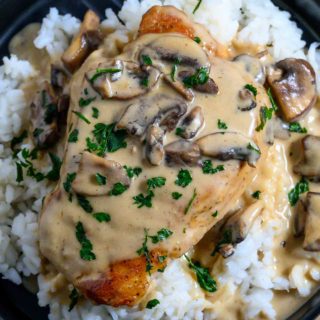 Pan Fried Pork Chops with Gravy on a plate.