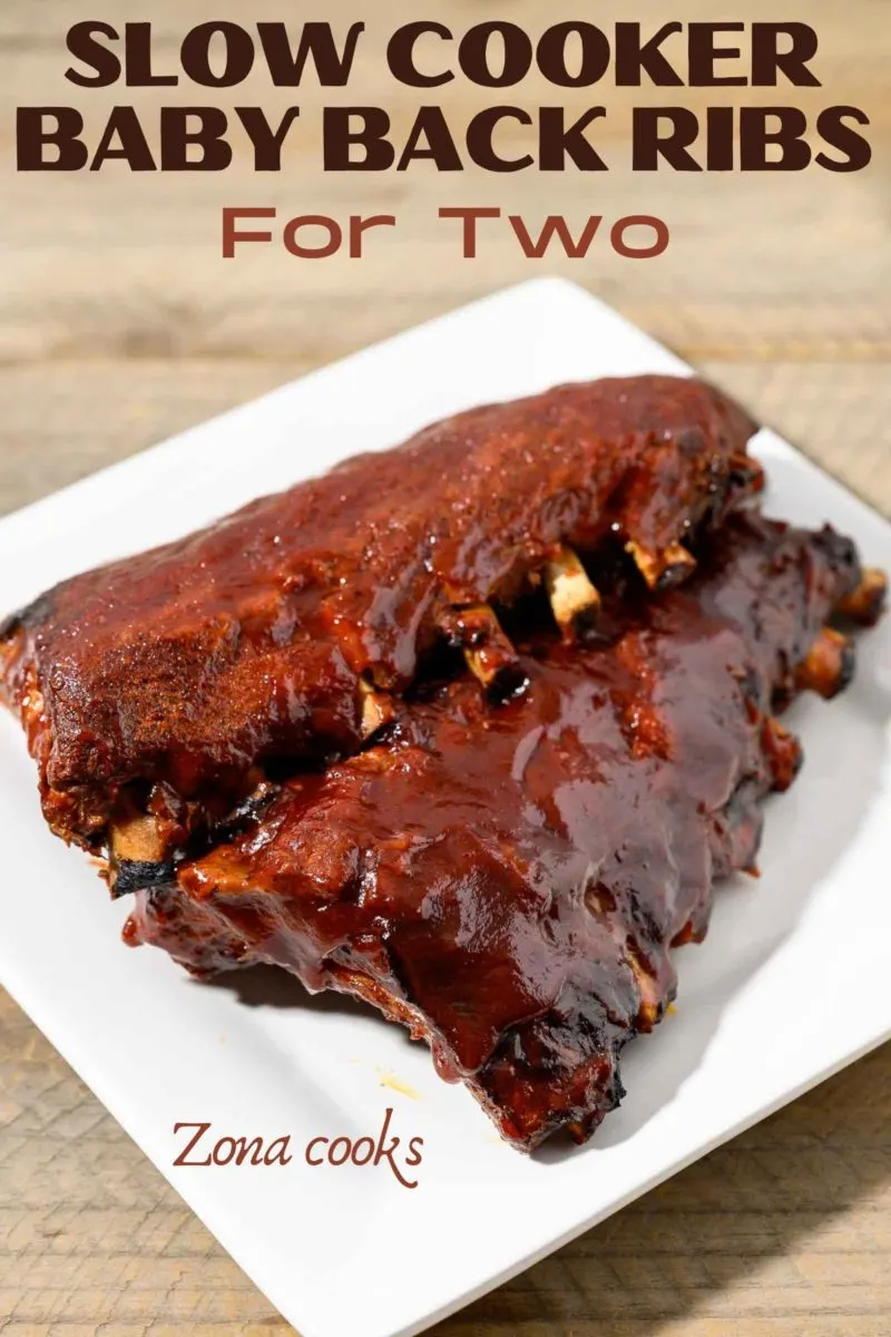 BBQ Ribs Crock Pot with two slabs of ribs on a plate.