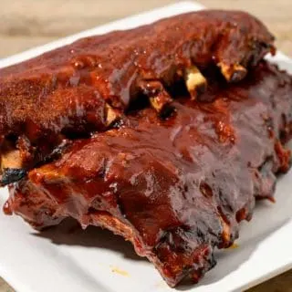 BBQ Ribs Slow Cooker with two slabs of ribs on a plate.