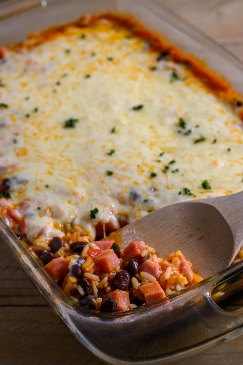 Mexican Rice Casserole with a spoon lifting some out.