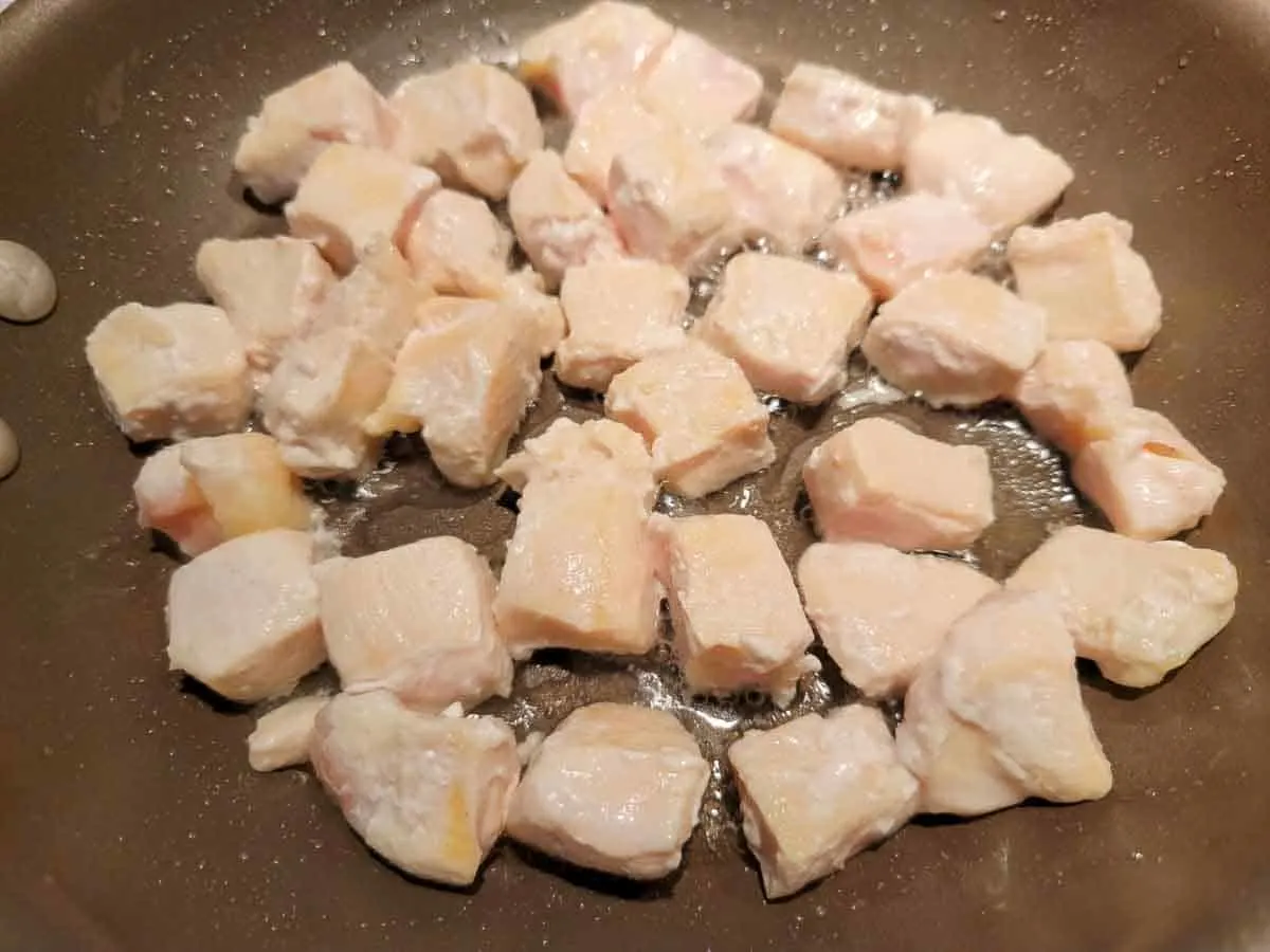 diced chicken cooking.