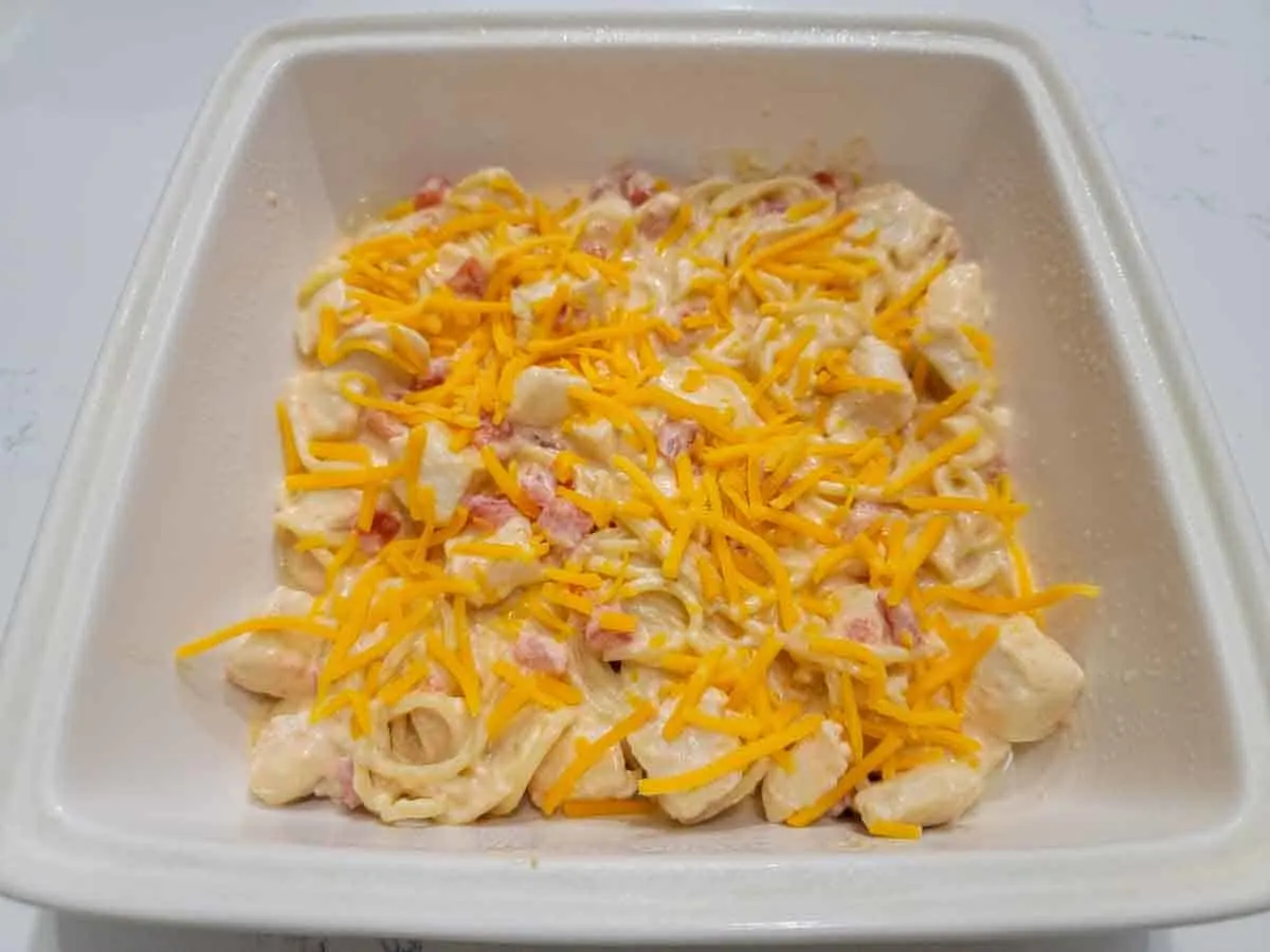rotel chicken bake topped with shredded cheese.