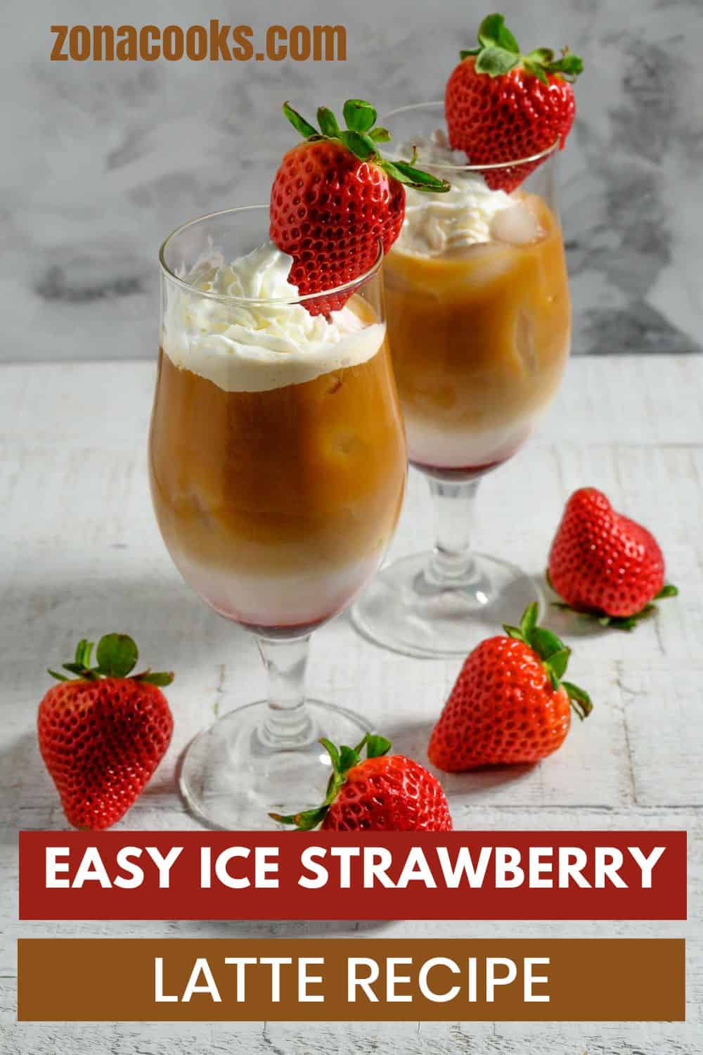 Easy Iced Strawberry Latte Recipe topped with whipped cream and a fresh strawberry.