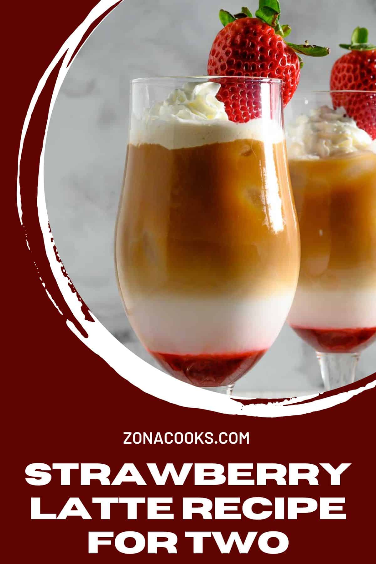 Strawberry Latte Recipe for Two topped with whipped cream and a fresh strawberry.
