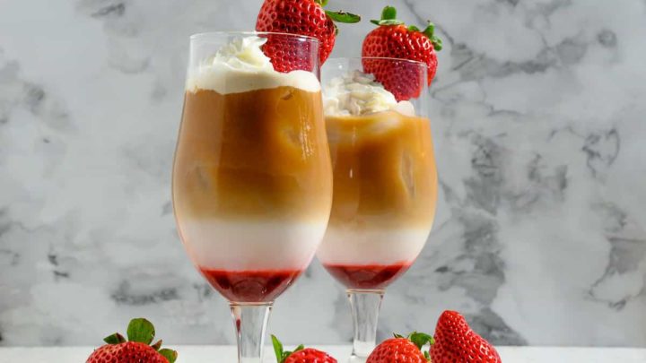 Strawberry Coffee Drink topped with whipped cream and a fresh strawberry.