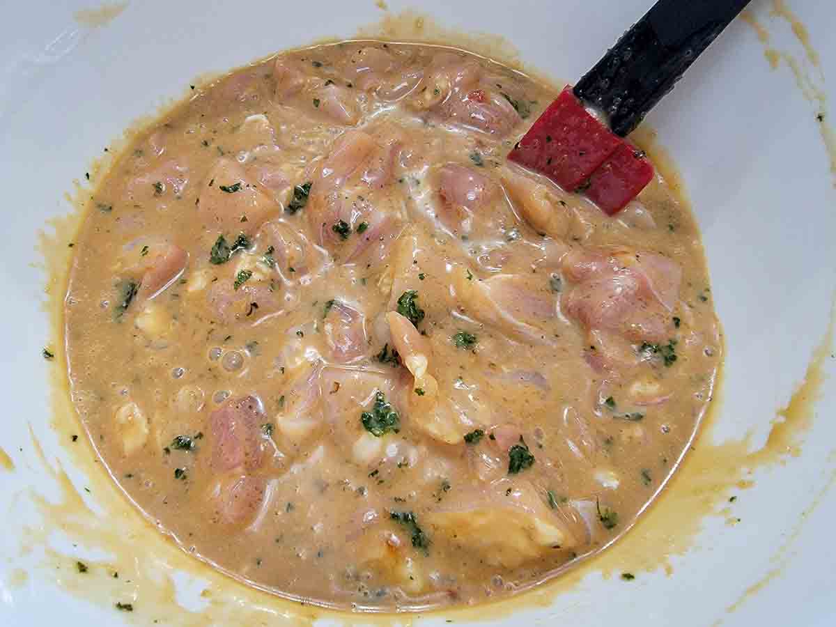 chicken marinating in thai peanut sauce.