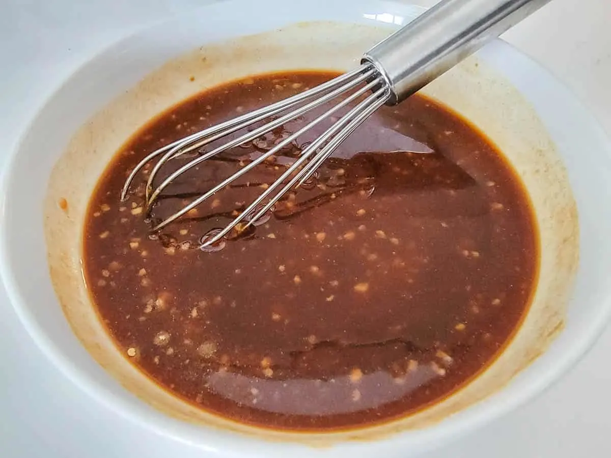 Asian bbq sauce whisked together in a bowl.