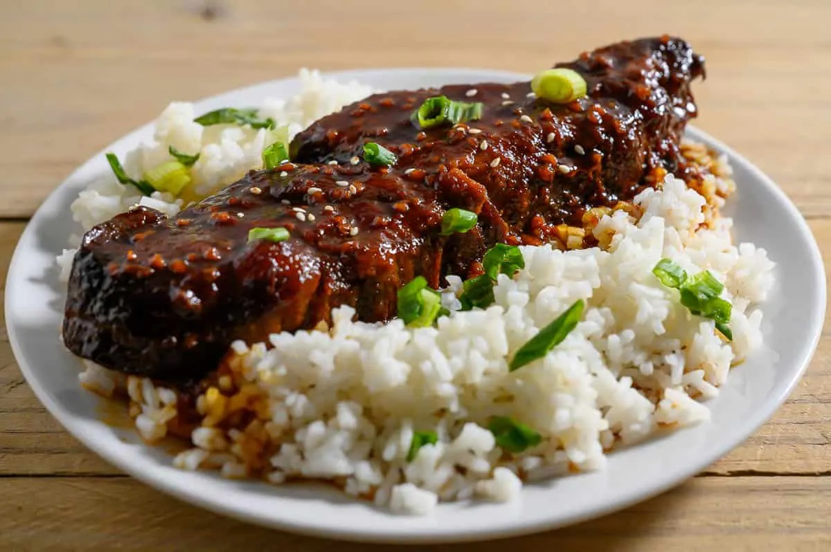 Slow Cooker Asian Country Style Ribs and rice on a plate.