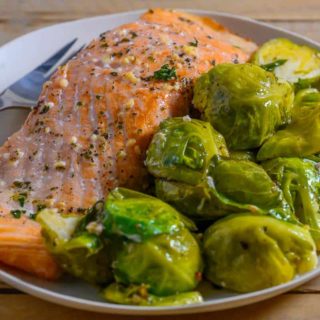 Baked Salmon and Brussels Sprouts on a plate.