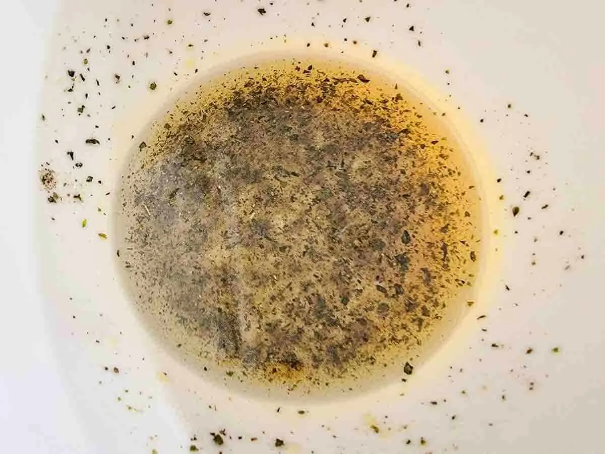 garlic, olive oil, oregano, salt and pepper in a bowl.