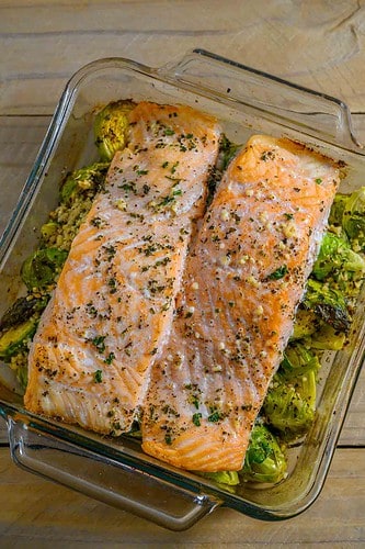 Garlic Roasted Salmon and Brussels Sprouts in a baking dish.