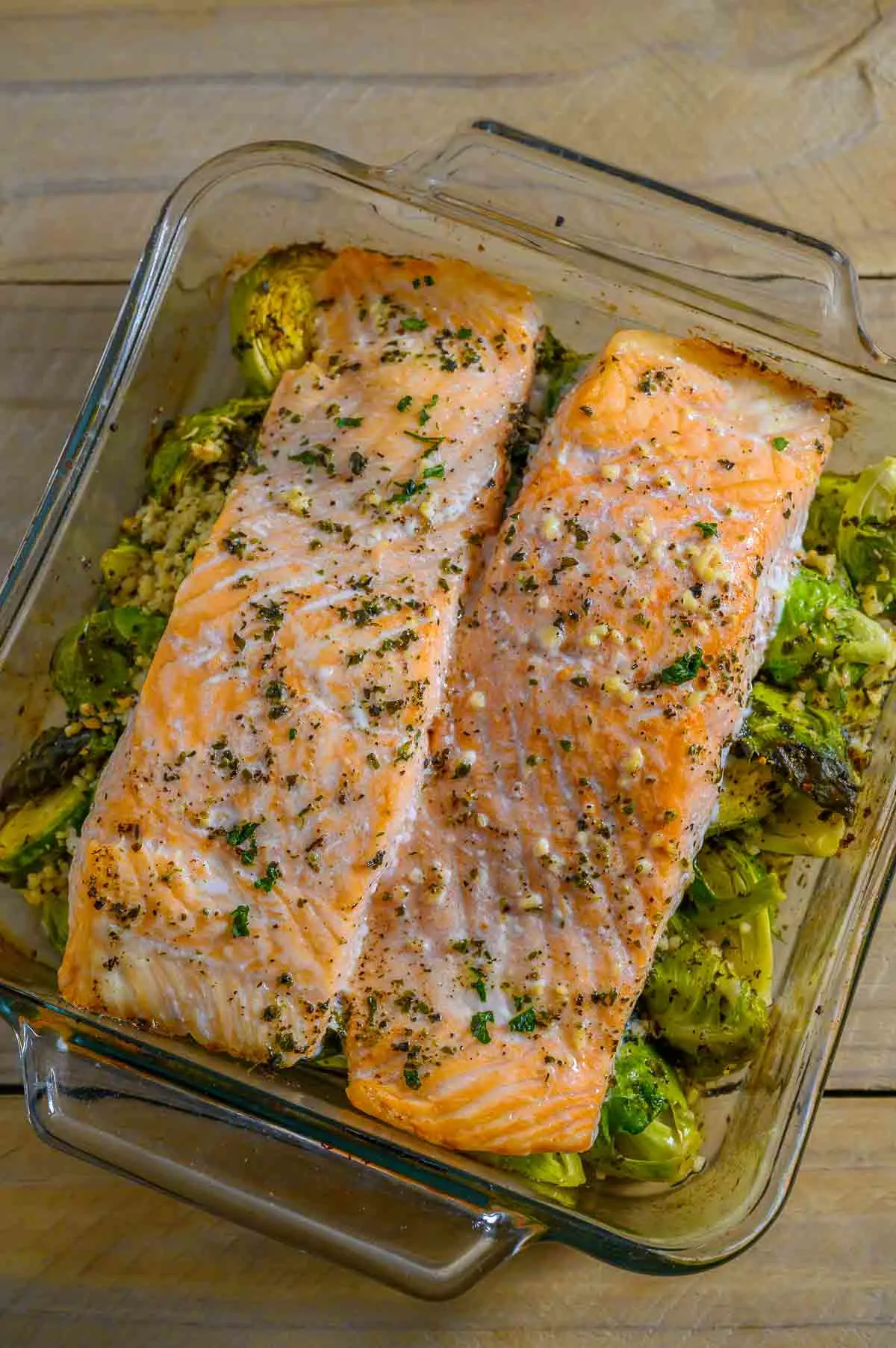 Garlic Roasted Salmon and Brussels Sprouts in a baking dish.