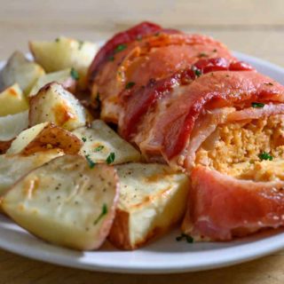 Italian Chicken Meatloaf and potatoes on a plate.