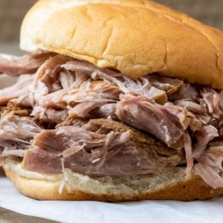 3 Ingredient Hawaiian Pulled Pork piled high on a bun.