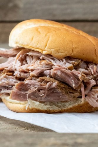 3 Ingredient Hawaiian Pulled Pork piled high on a bun.