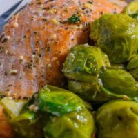 Baked Salmon and Brussels Sprouts on a plate.