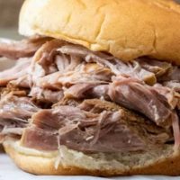 3 Ingredient Hawaiian Pulled Pork piled high on a bun.