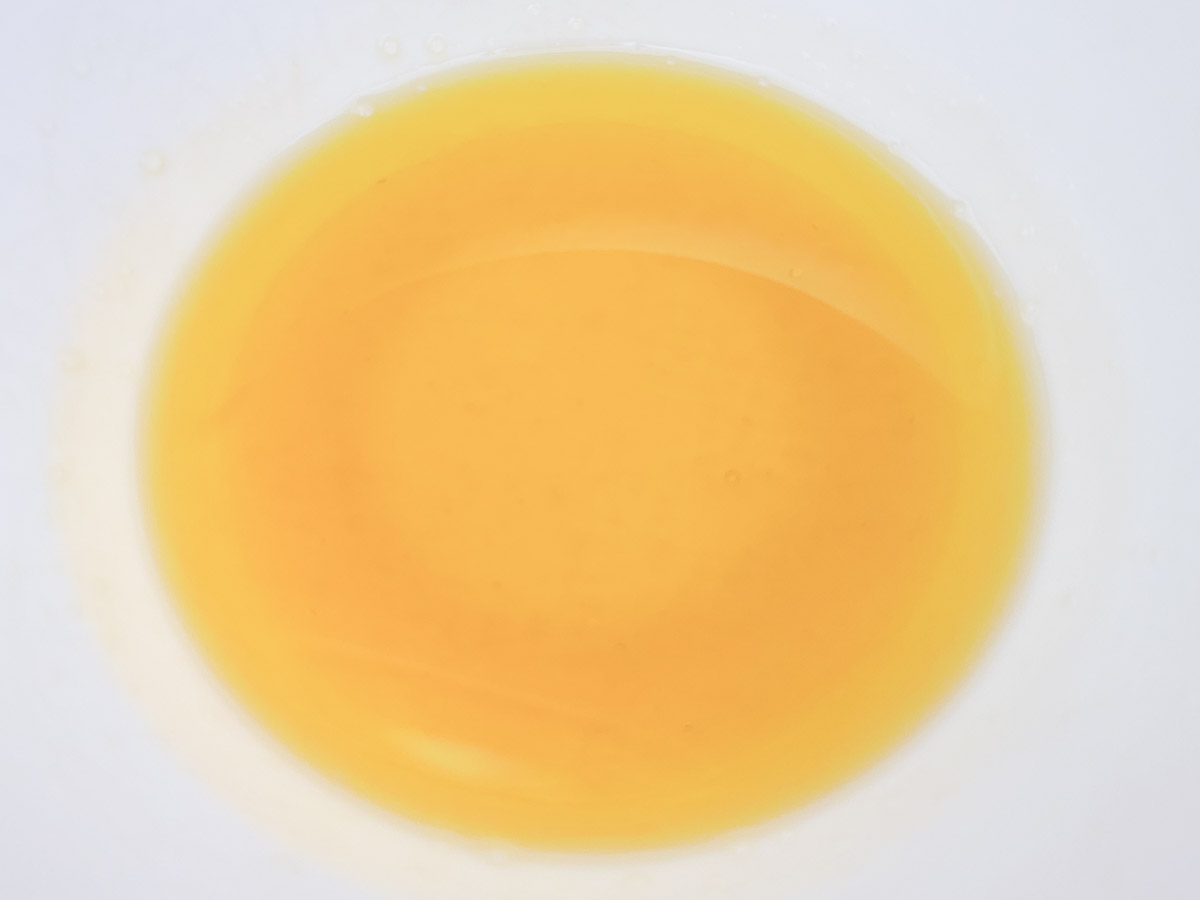 honey and olive oil mixed in a bowl.