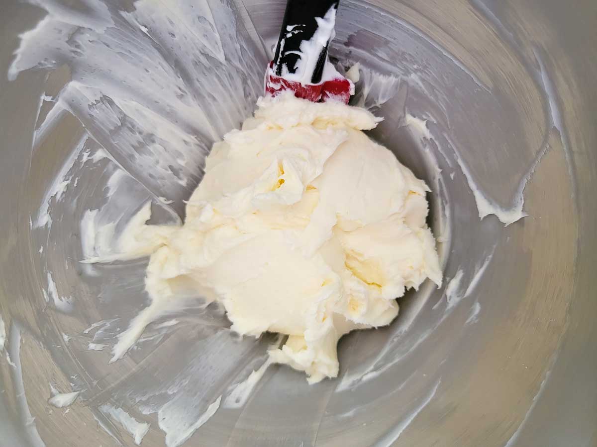cream cheese and powdered sugar mixed in a bowl.