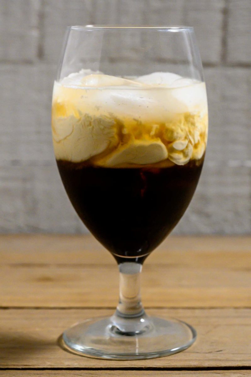 Skrewball White Russian unstirred in a glass.