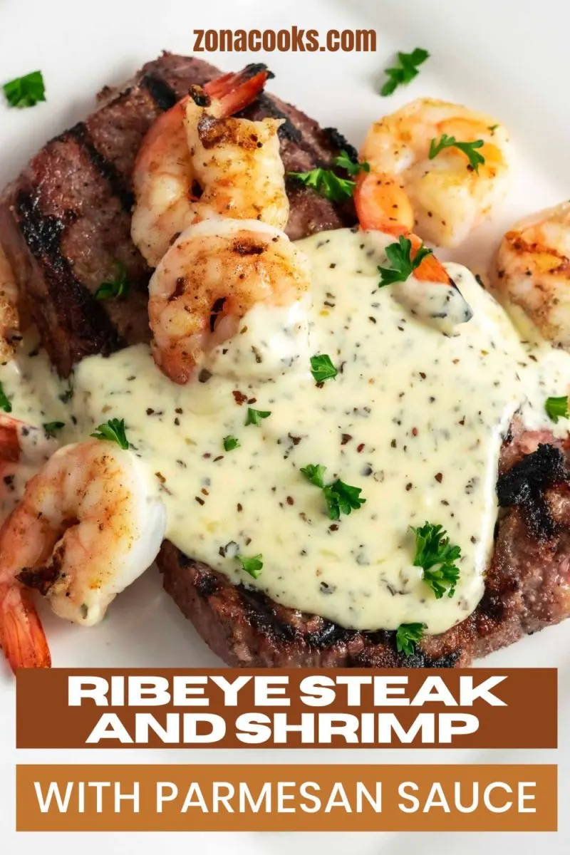 Ribeye Steak and Shrimp with Parmesan Sauce on a plate.