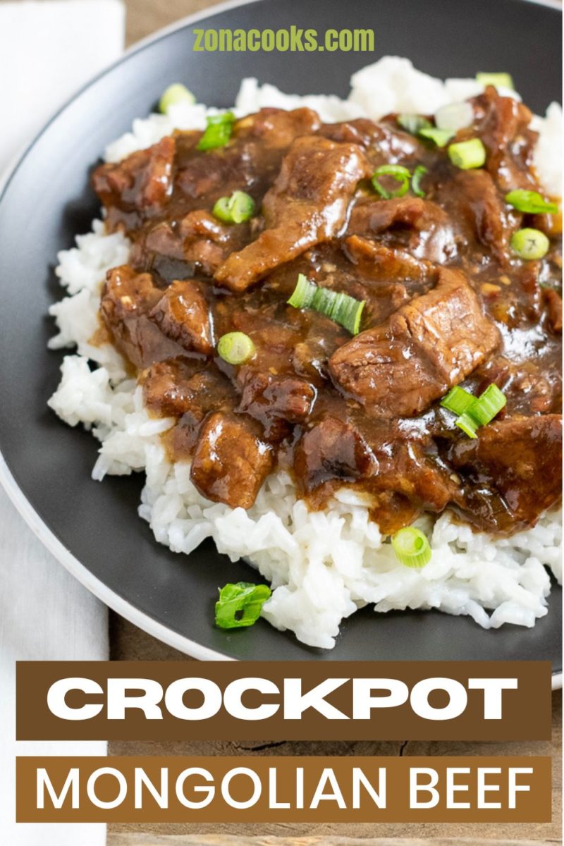 Crockpot Mongolian Beef over rice on a plate.