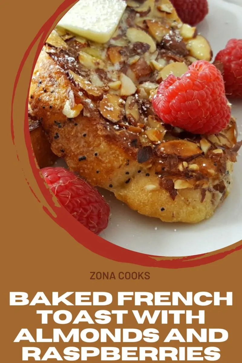 Baked French Toast with Almonds and Raspberries on a plate.