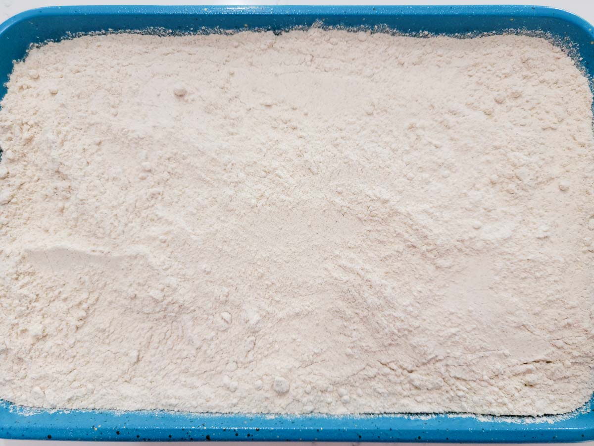 spice cake mix over apple pie filling in a cake pan.