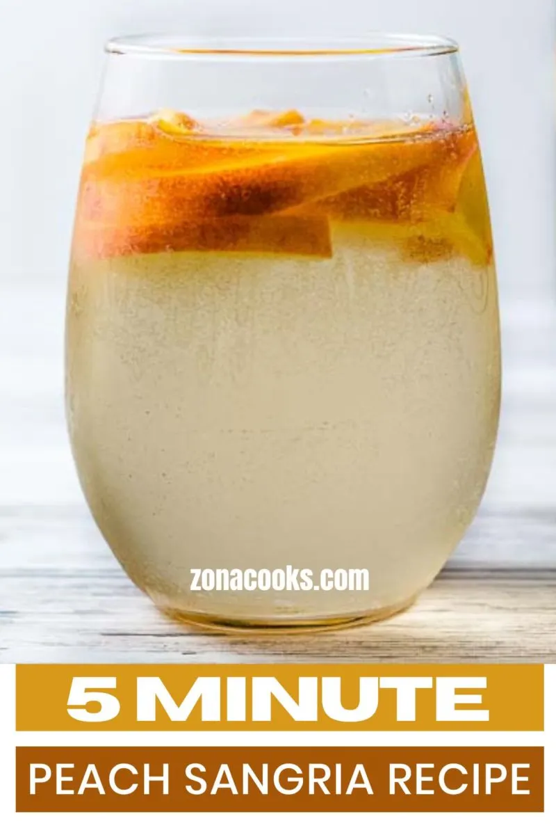 5 Minute Peach Sangria in a glass with peach slices.