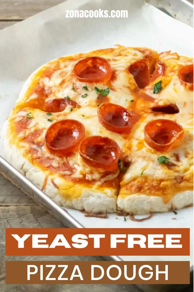 Yeast Free Pizza Dough topped with pizza sauce, cheese, and pepperoni.