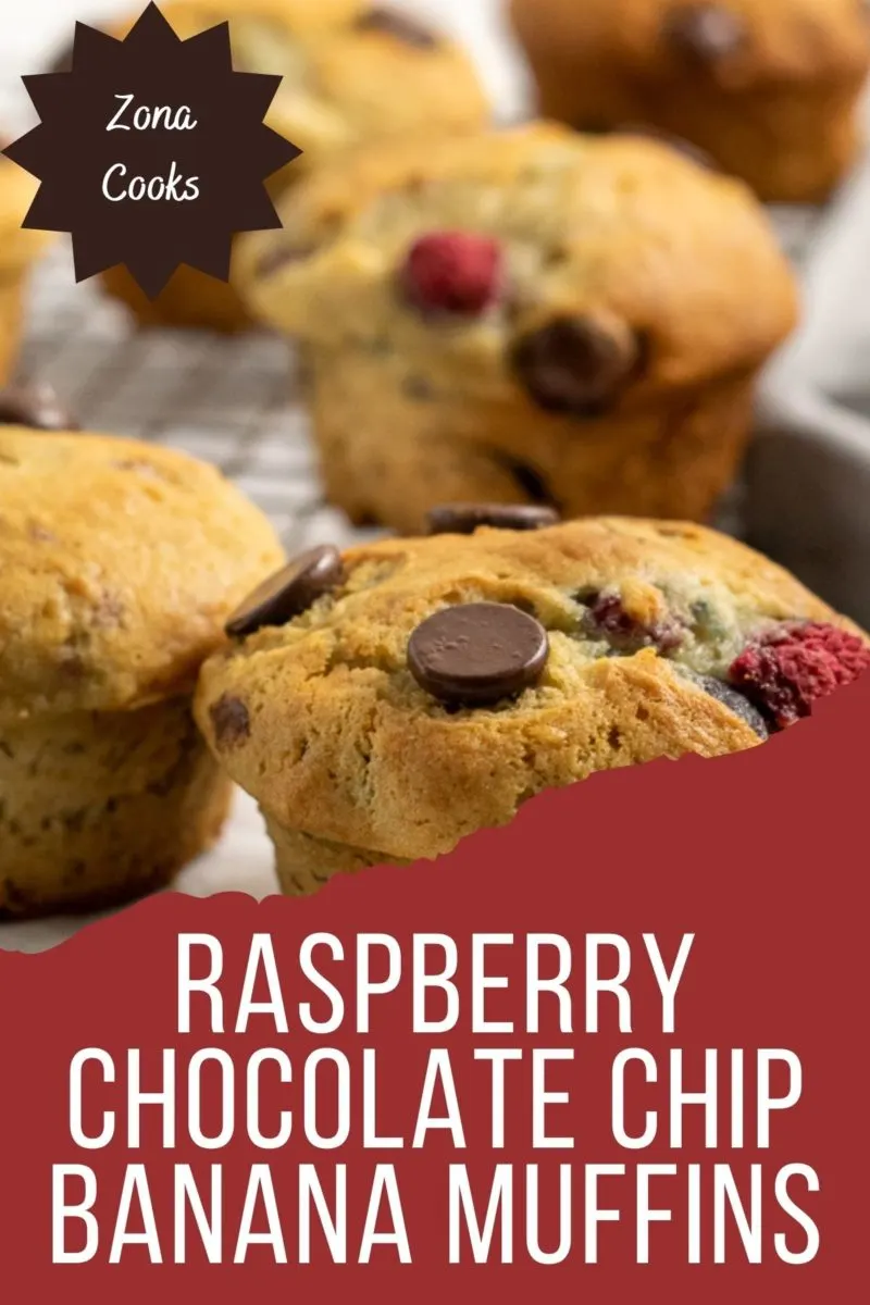 Raspberry Chocolate Chip Banana Muffins on a wire rack.