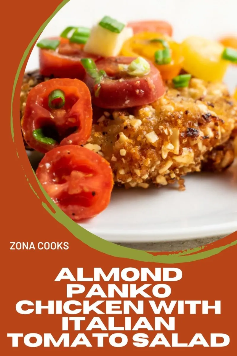 Almond Panko Chicken with Italian Tomato Salad on a plate.