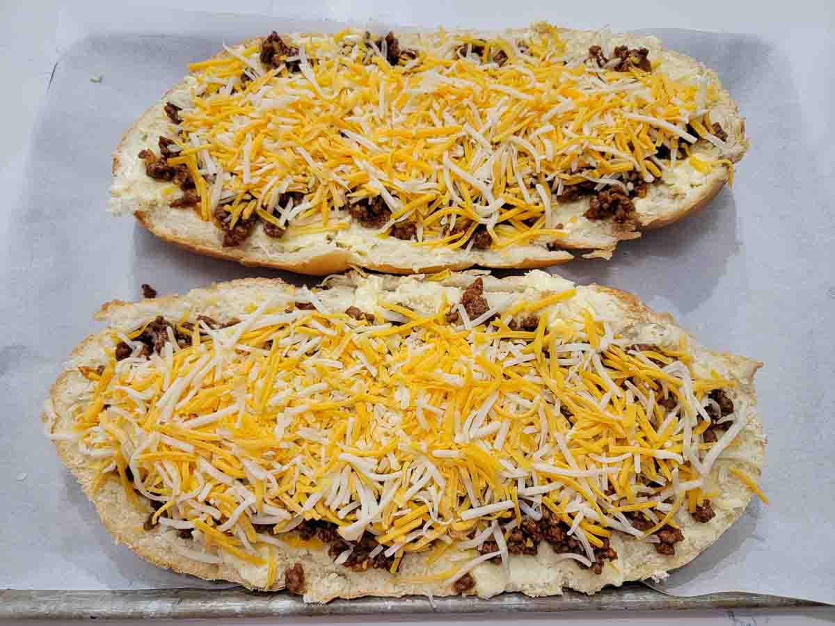 sloppy joe meat and shredded cheese layered on garlic bread.